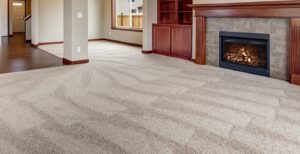 Clean carpet with vacuum lines, empty living room, gas fireplace
