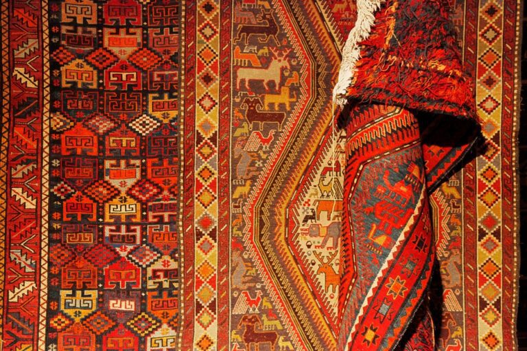 Close-up view of oriental rug, red pattern